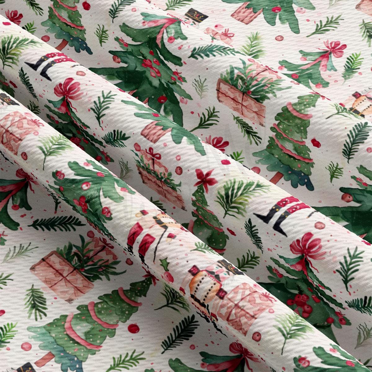a close-up view of a fabric with a repeating pattern of Christmas trees, presents, and other festive elements. The pattern is predominantly green and red, with some white and brown accents. The fabric appears to be made of a soft, textured material, suitable for use as a holiday-themed textile or gift wrapping material.
