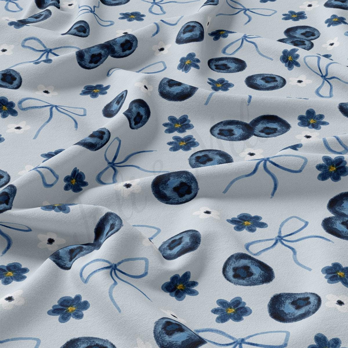 a close up of a blue and white flower print fabric