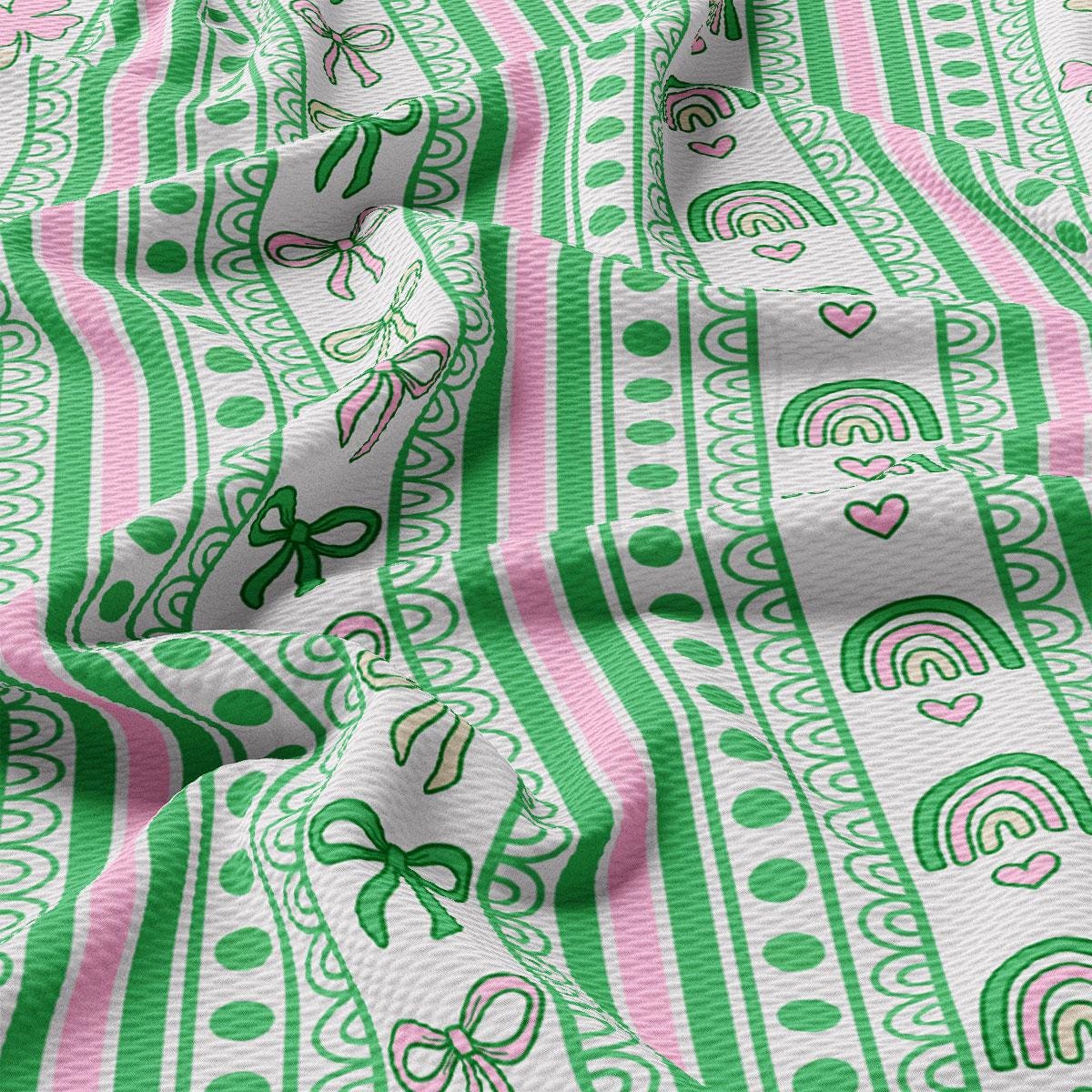 a close up of a green and pink patterned fabric