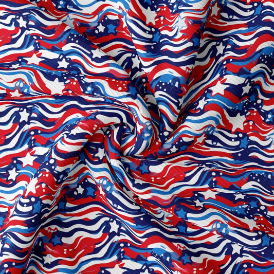 a red, white, and blue fabric with wavy lines