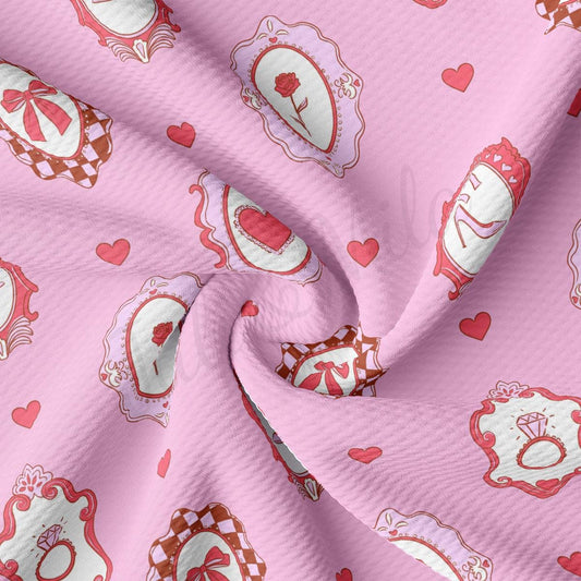 a pink fabric with hearts on it