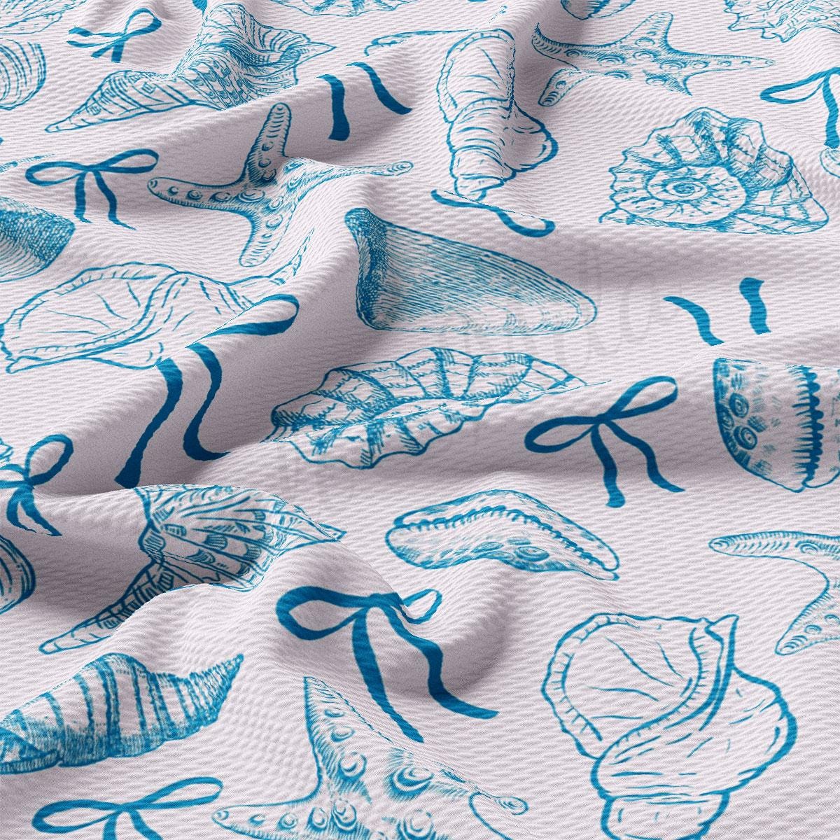 a close up of a blue and white fabric