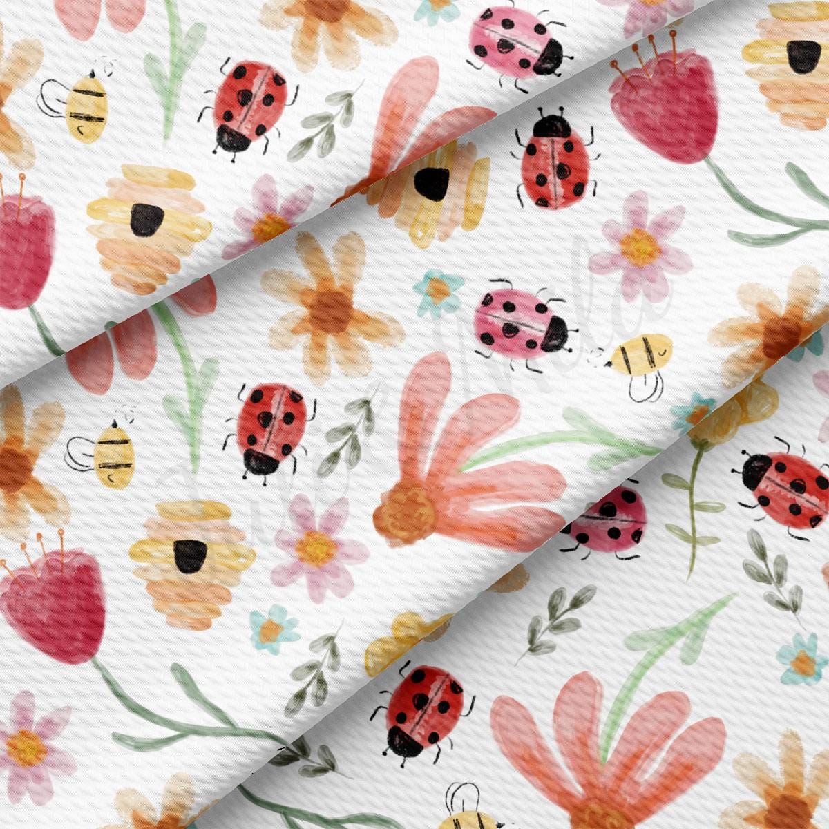 a white background with ladybugs and flowers