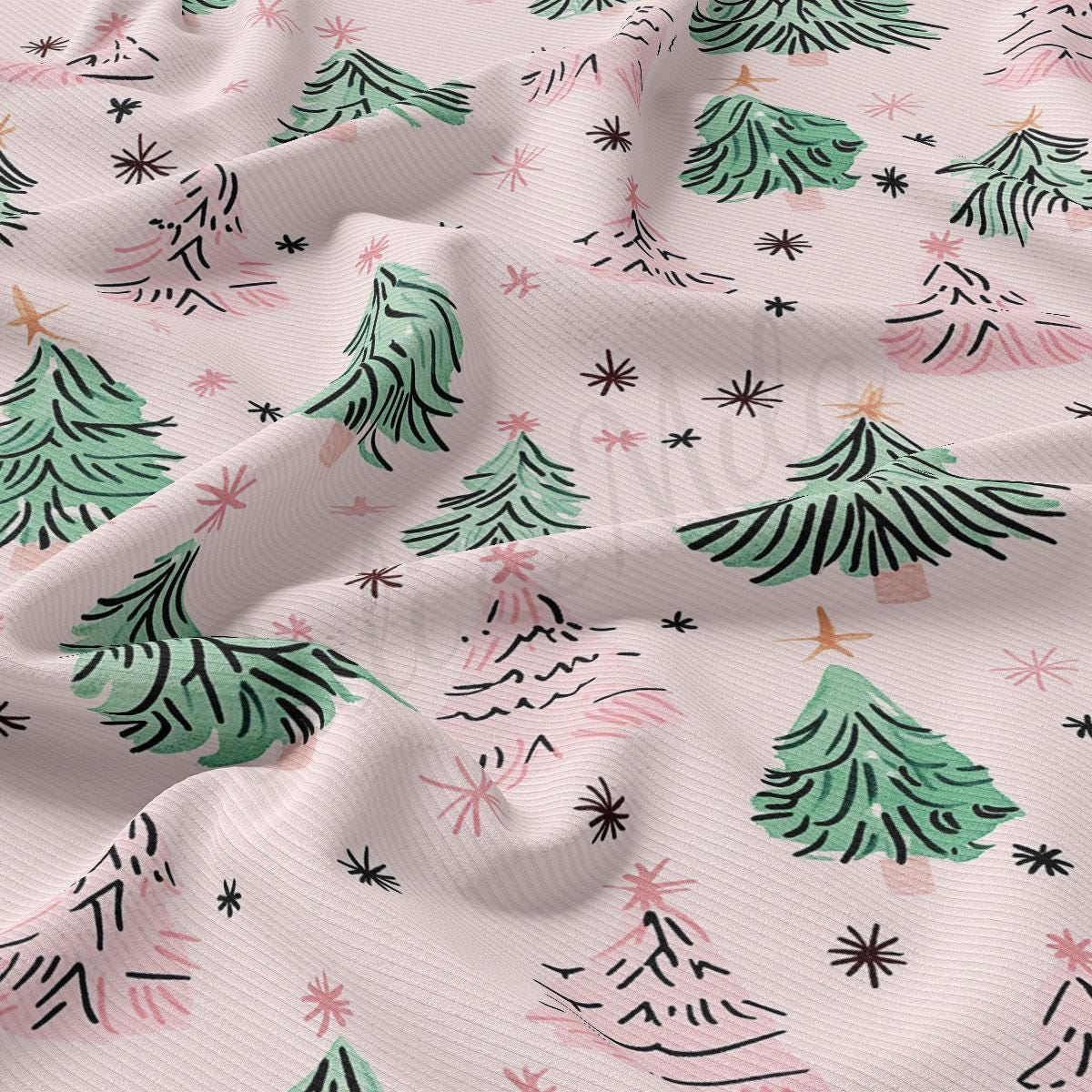 a repeating pattern of stylized Christmas trees in shades of pink and green, with scattered stars and dots throughout the fabric.