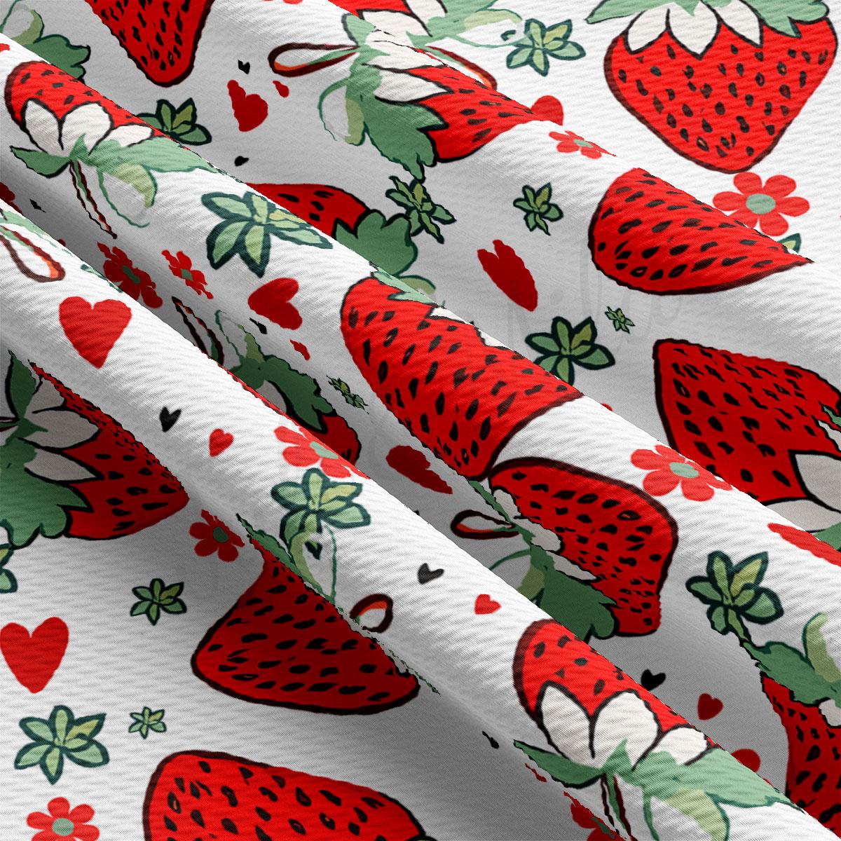 a close-up view of a fabric with a repeating pattern of red strawberries and green leaves. The pattern is vibrant and colorful, with the strawberries and leaves filling the entire fabric. The fabric appears to be made of a soft, plush material, and the pattern is well-spread across the entire surface.