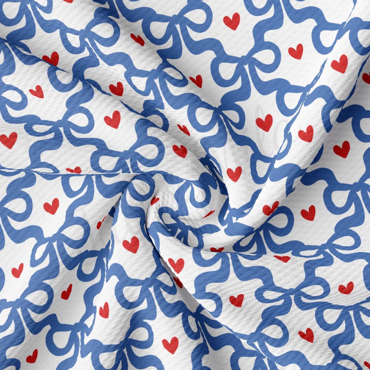 a white and blue fabric with red hearts on it