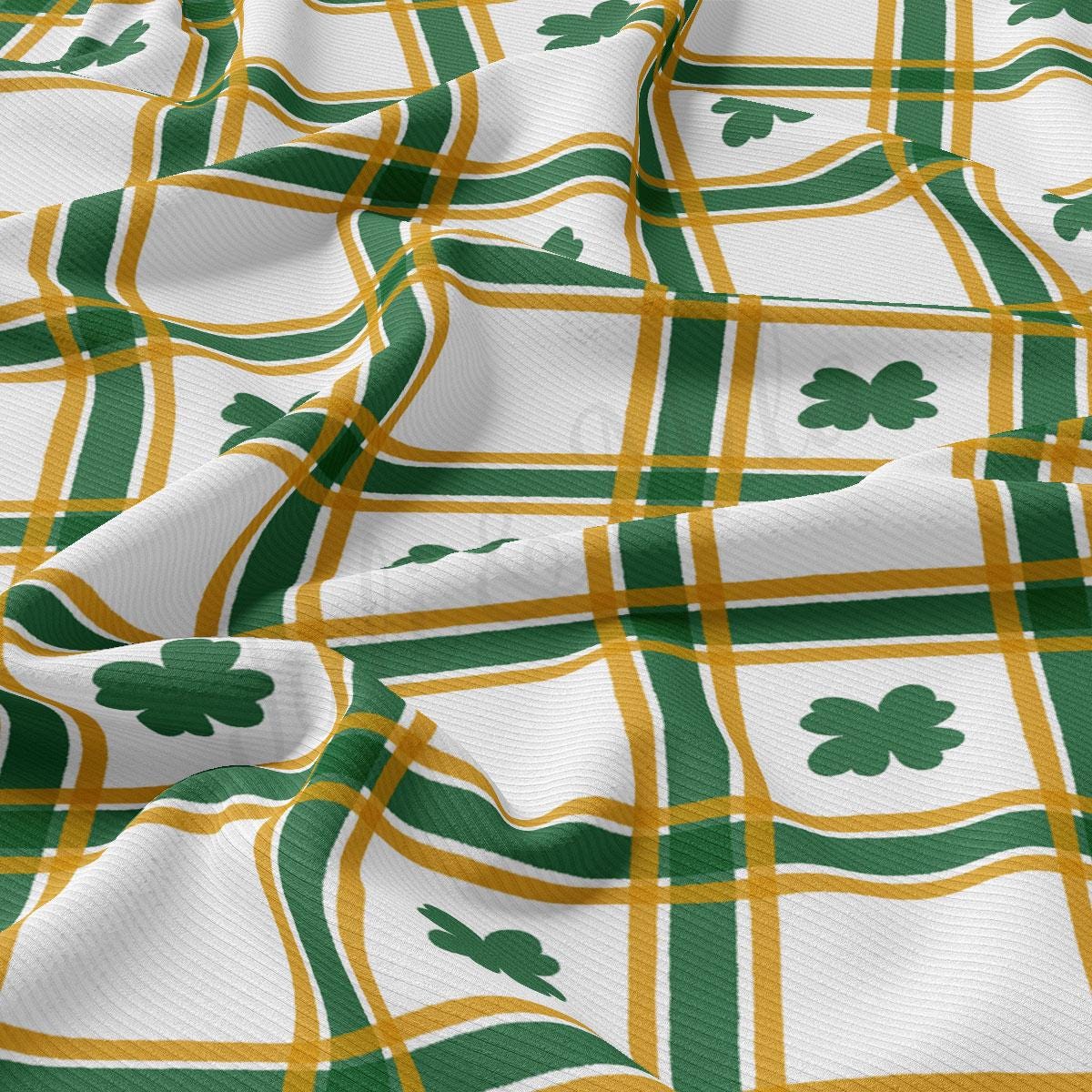 a green and yellow plaid with shamrocks on it