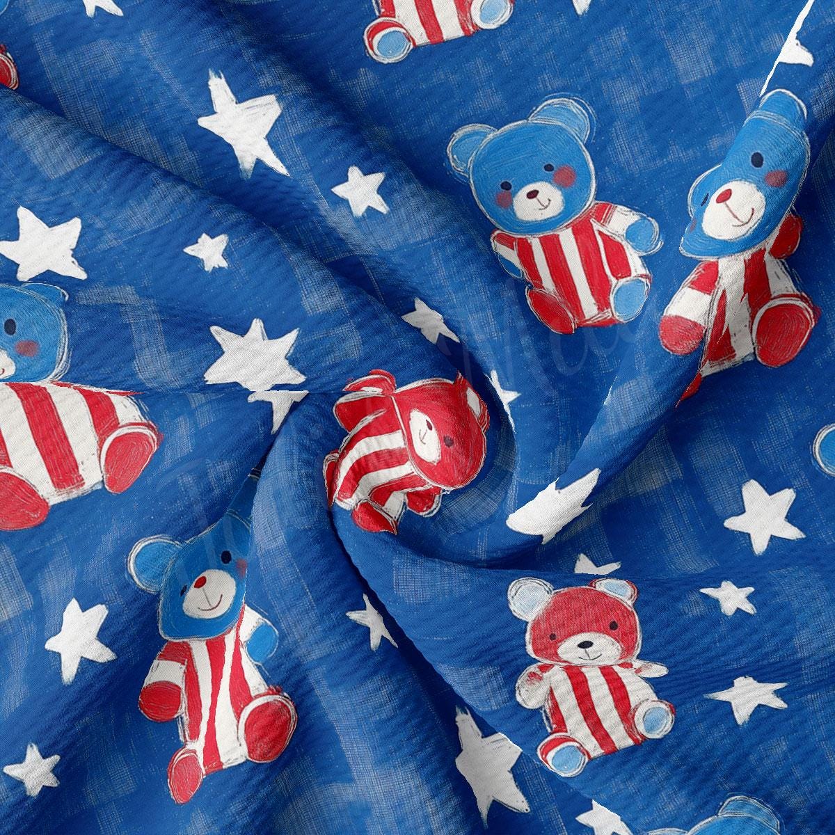 a blue fabric with red, white and blue teddy bears on it