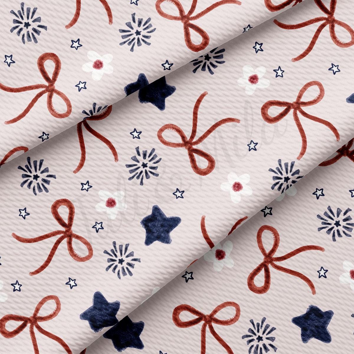 a white fabric with red, white and blue bows