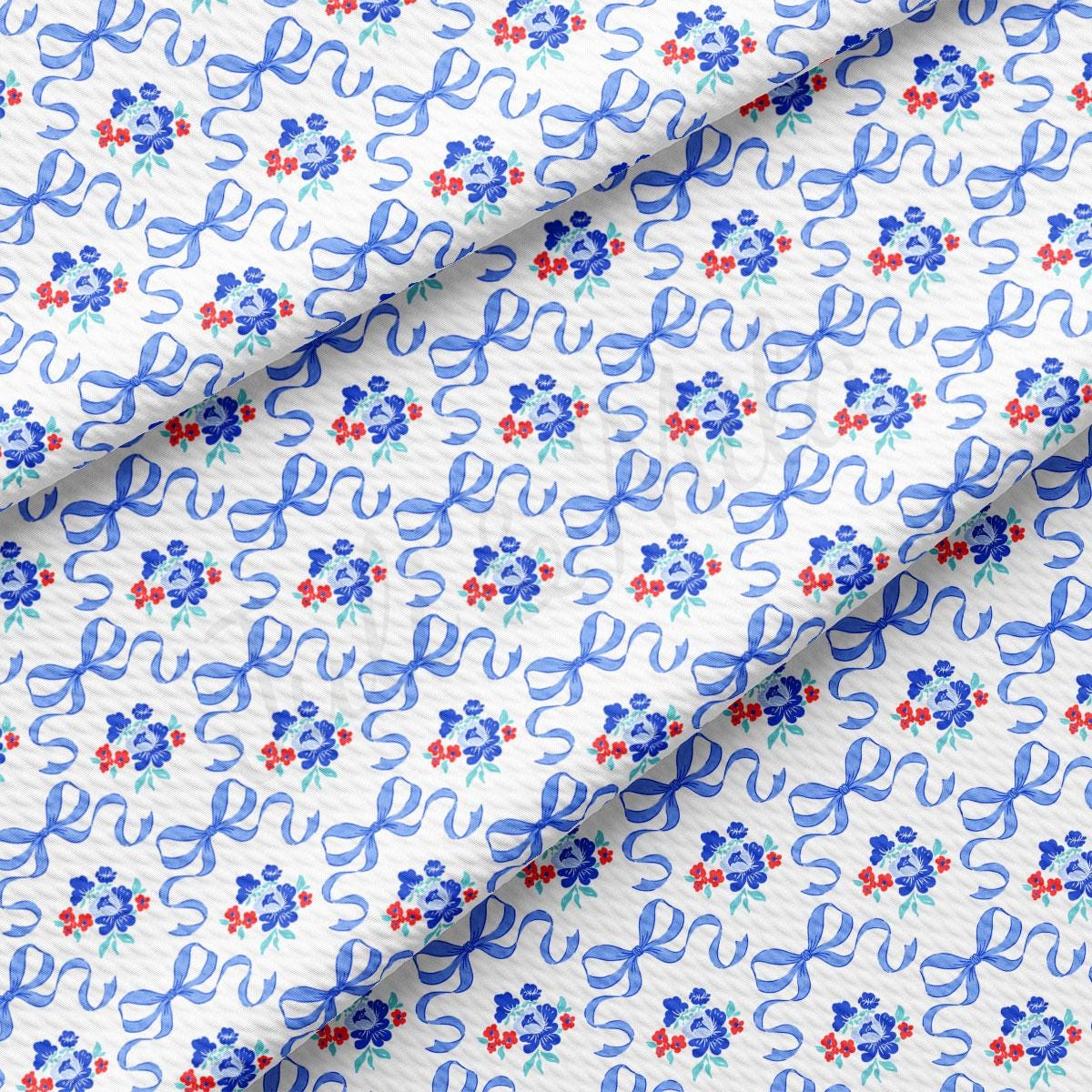 a blue and red floral print on a white background