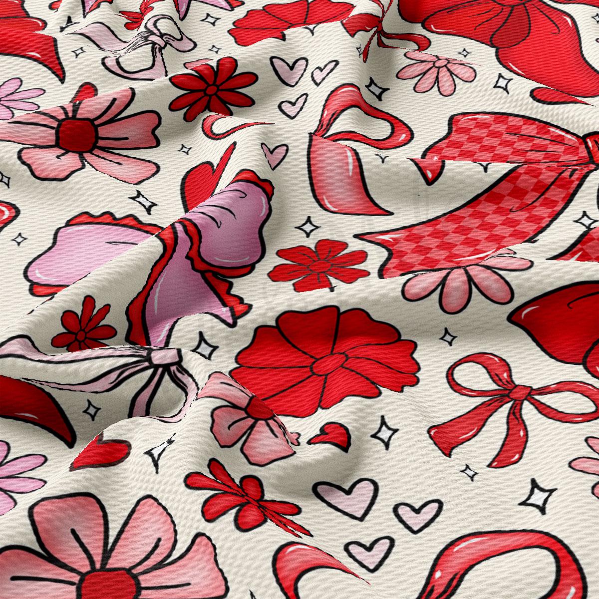 The image is a close-up of a fabric with a repeating pattern of red flowers and bows, along with some hearts and stars scattered throughout.