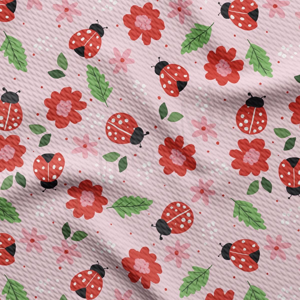 a pink background with ladybugs and flowers