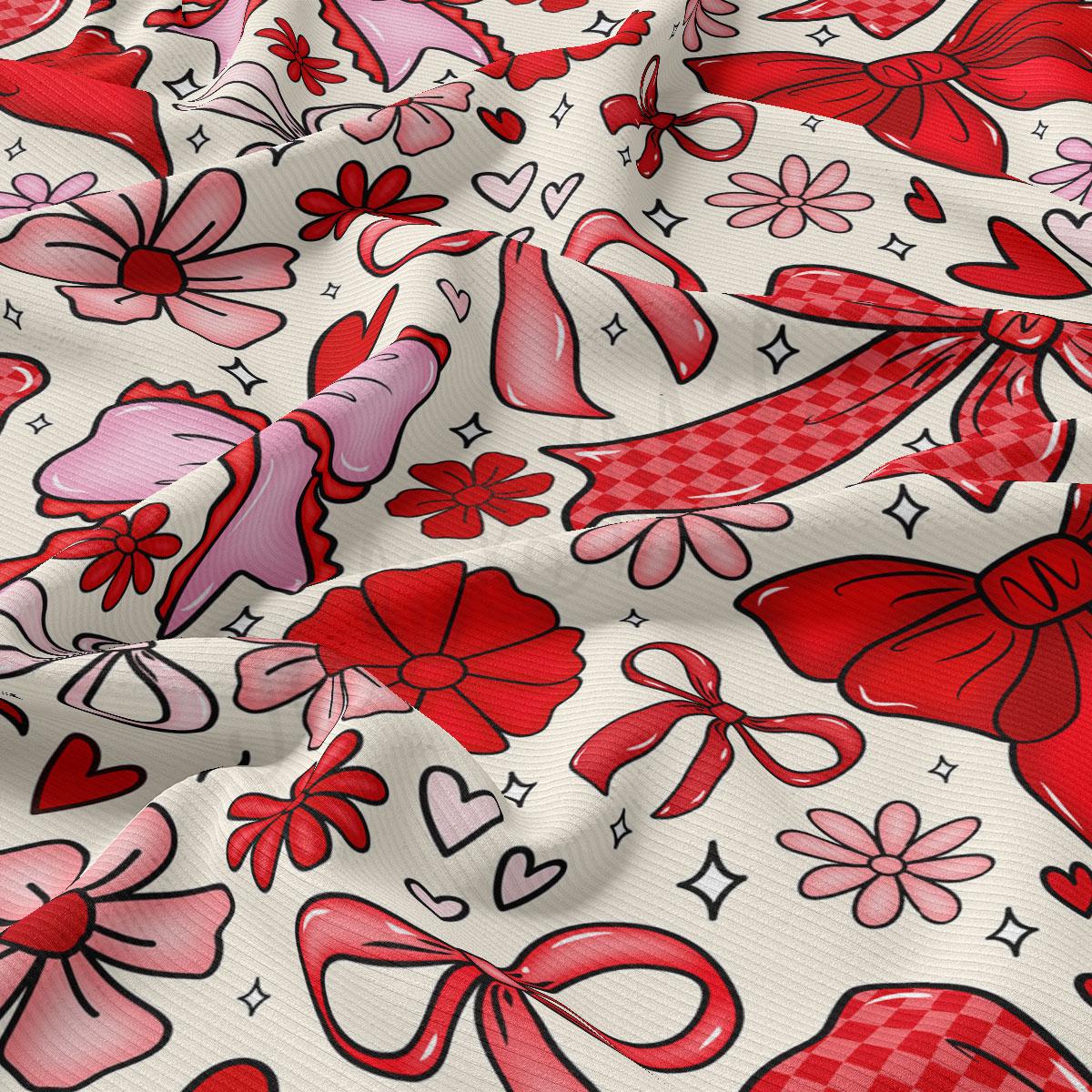 The image is a close-up of a fabric with a repeating pattern of red bows and flowers, along with some hearts and stars scattered throughout.