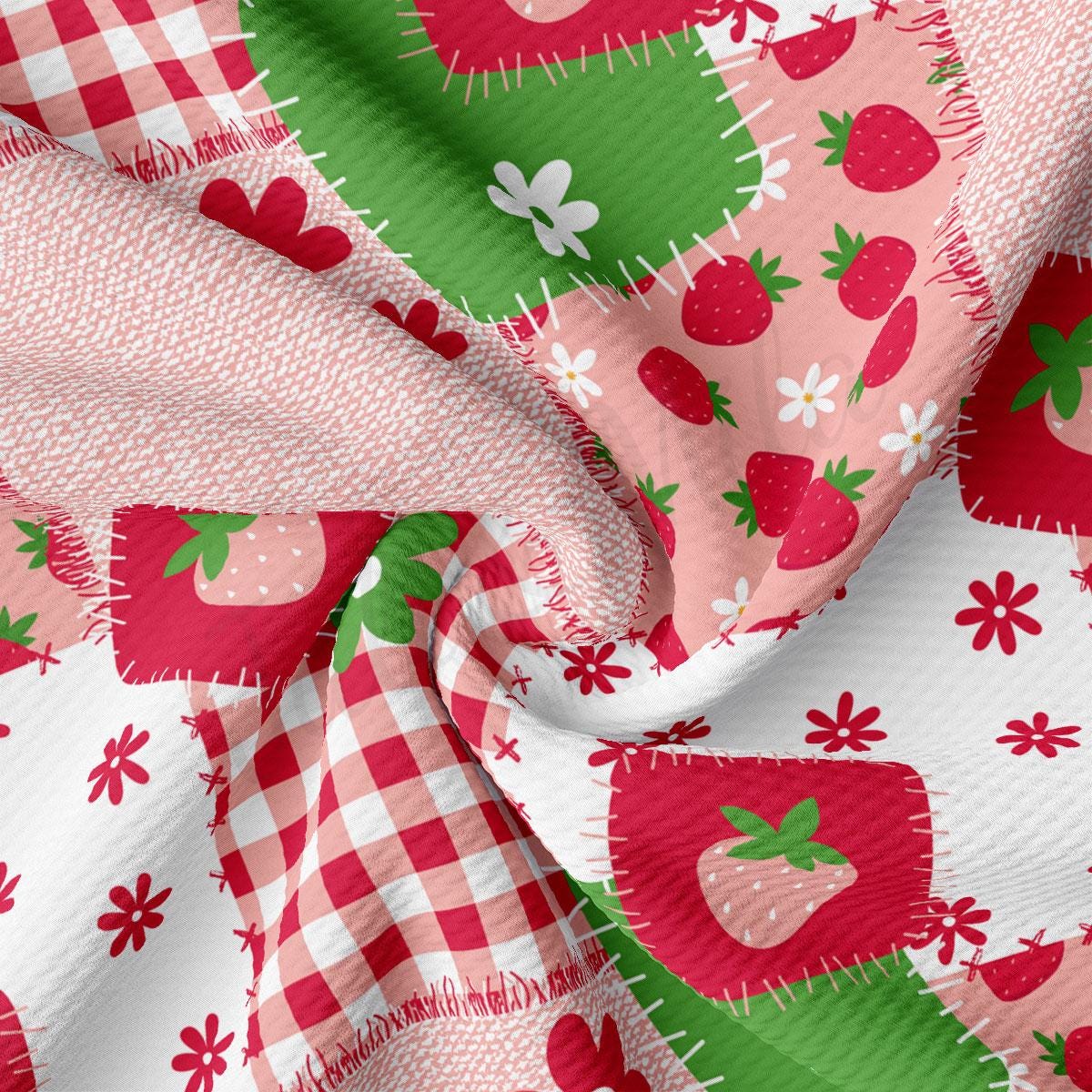 a red and white checkered fabric with strawberries on it