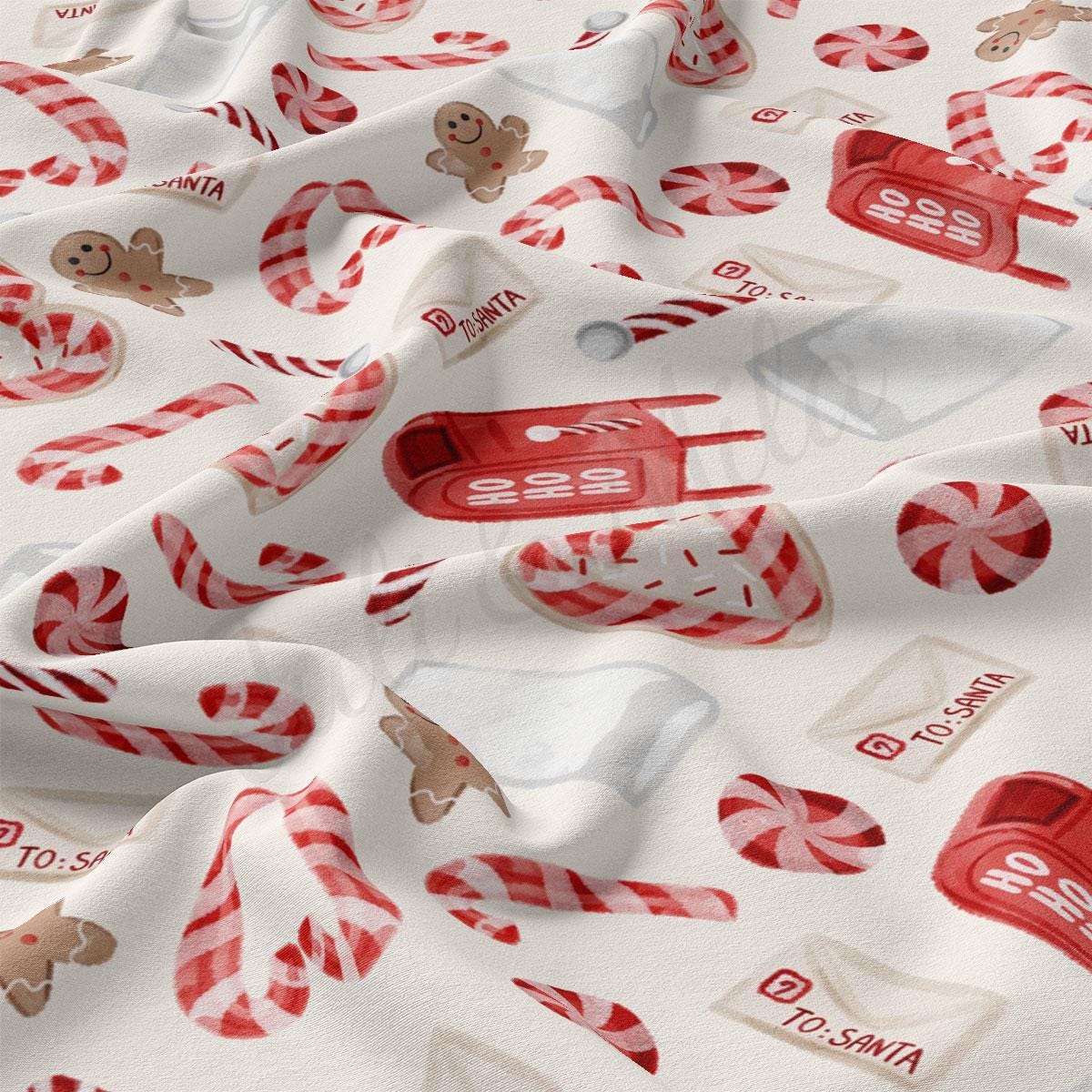 a white fabric with candy canes and candies on it