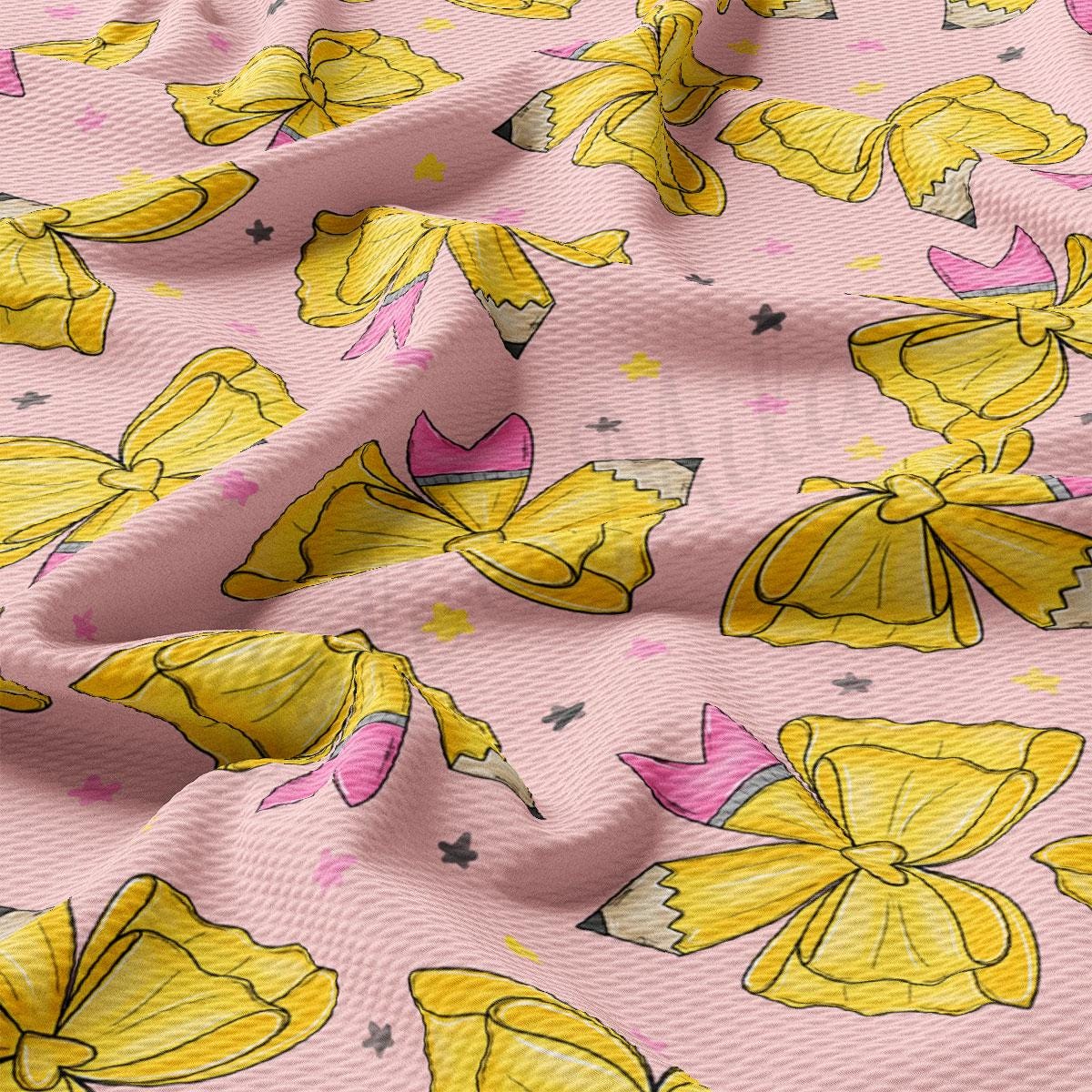 a close-up view of a fabric with a repeating pattern of yellow pencils and yellow flowers on a pink background.
