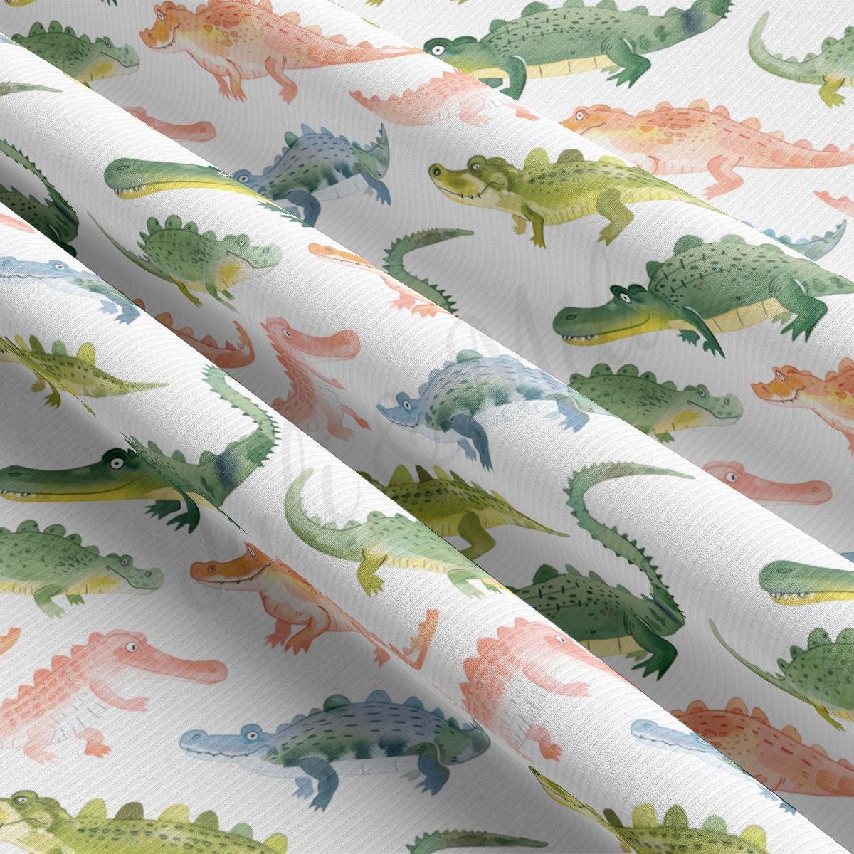 a close up of a pattern of dinosaurs on a white background
