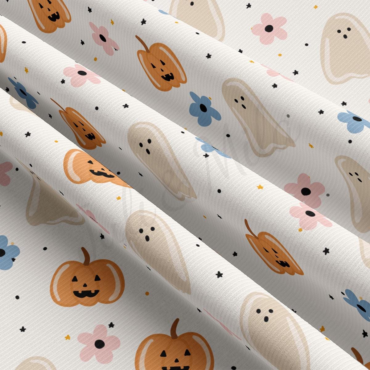 a close-up view of a fabric with a repeating pattern of Halloween-themed elements, including pumpkins, ghostly figures, and flowers.