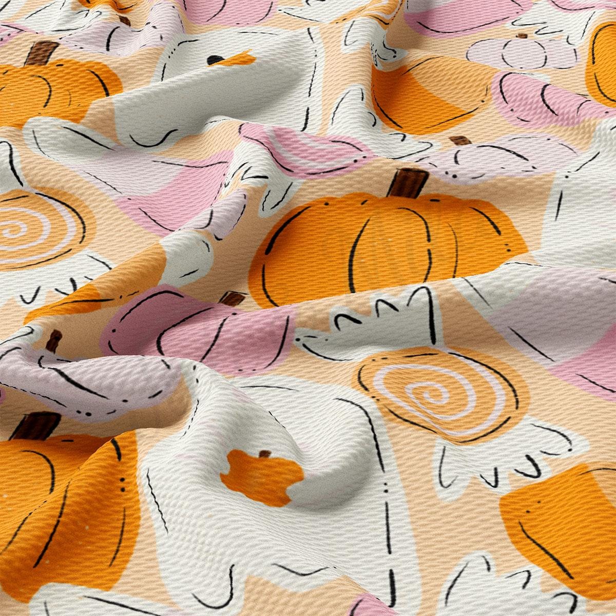 a close-up view of a fabric with a repeating pattern of orange and white pumpkins and a ghost-like shape.