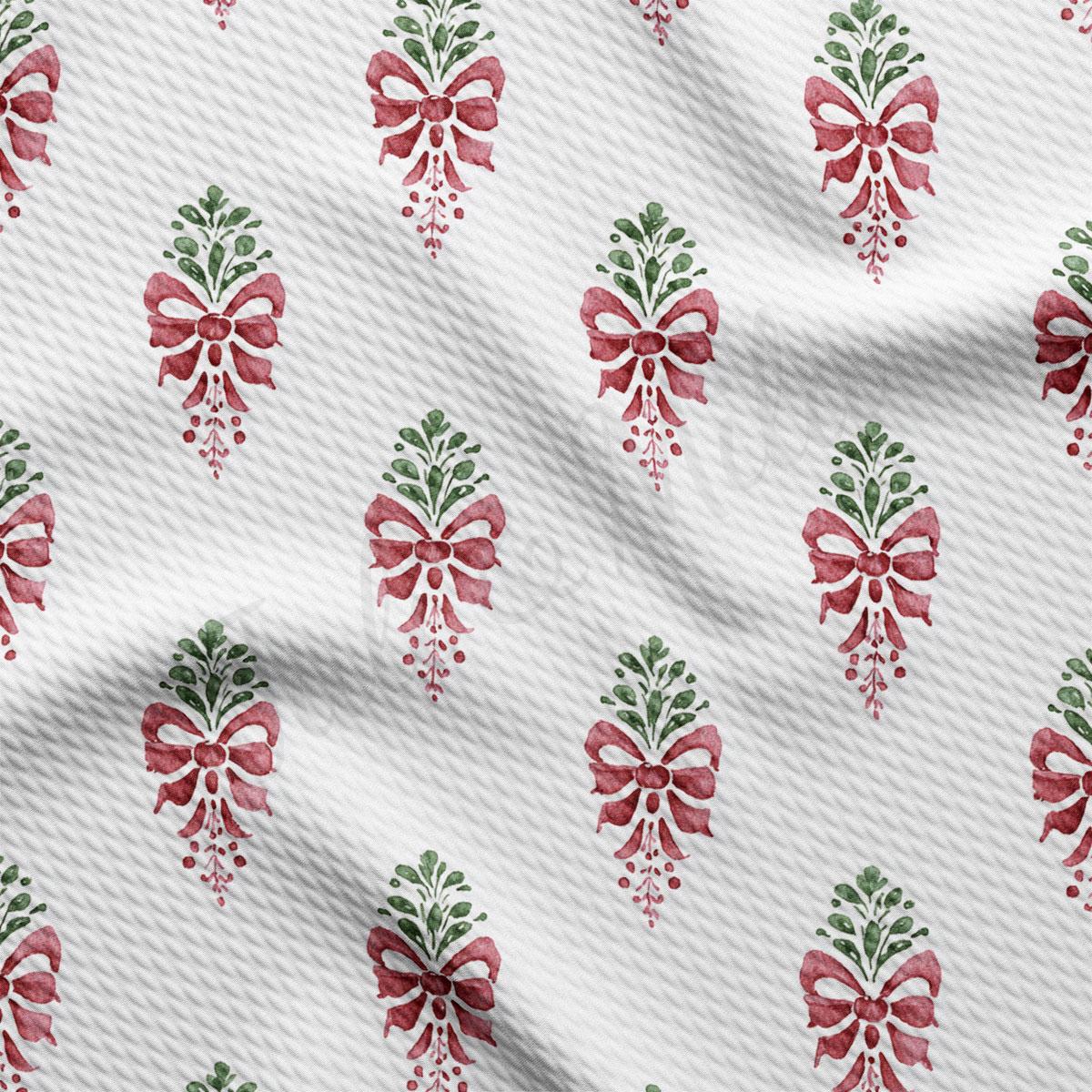 a repeating pattern of red bows with green leaves on a white background.