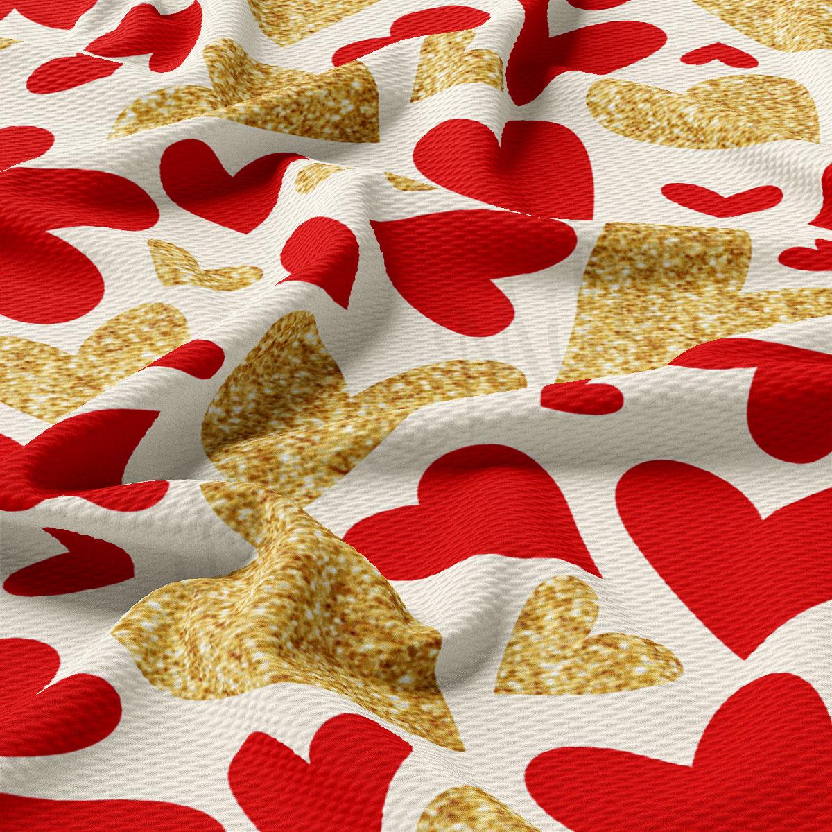 a close-up view of a fabric with a repeating pattern of red and gold hearts. The pattern is composed of various sizes and shapes of hearts, creating a visually striking and textured design.