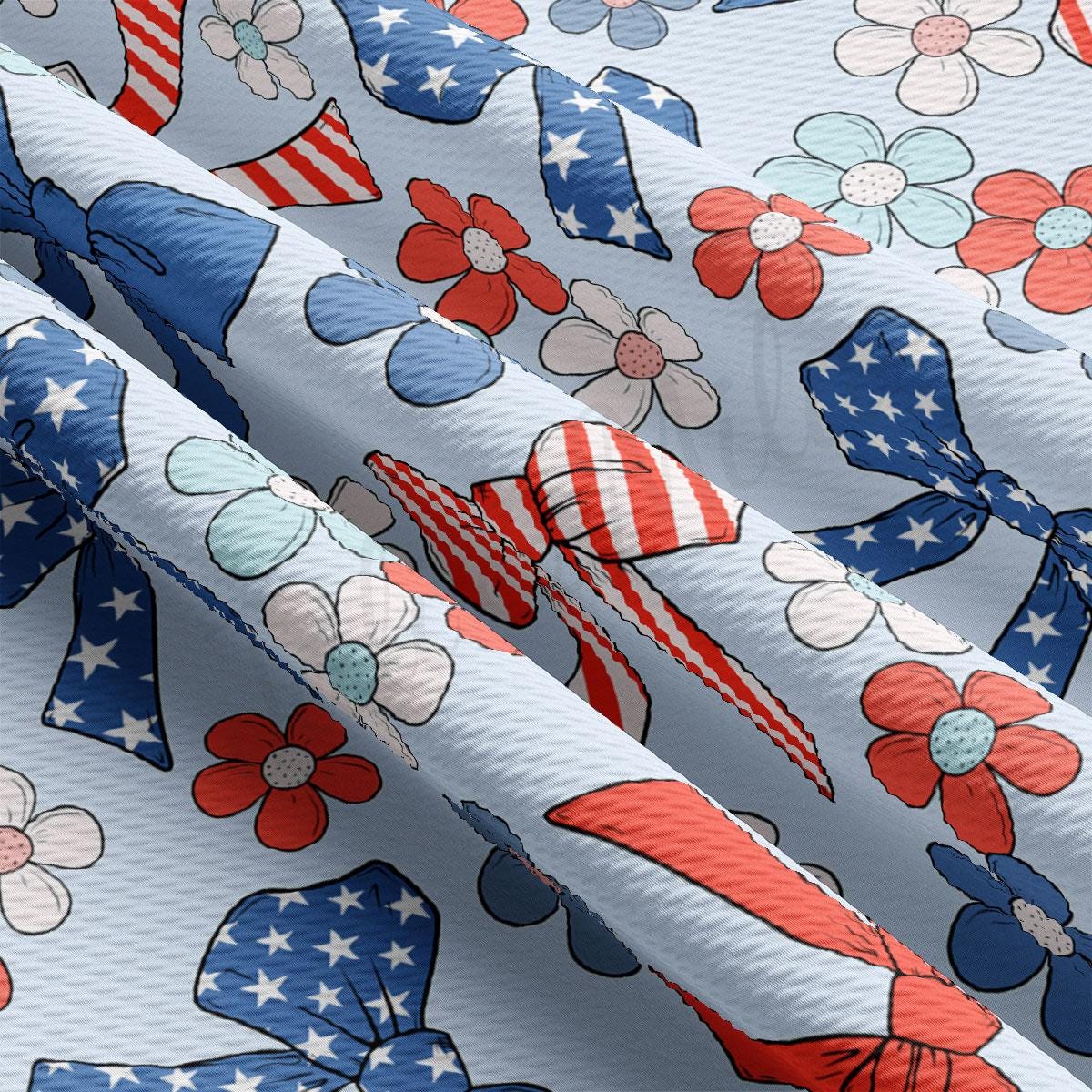 a close up of a pattern of bows and flowers