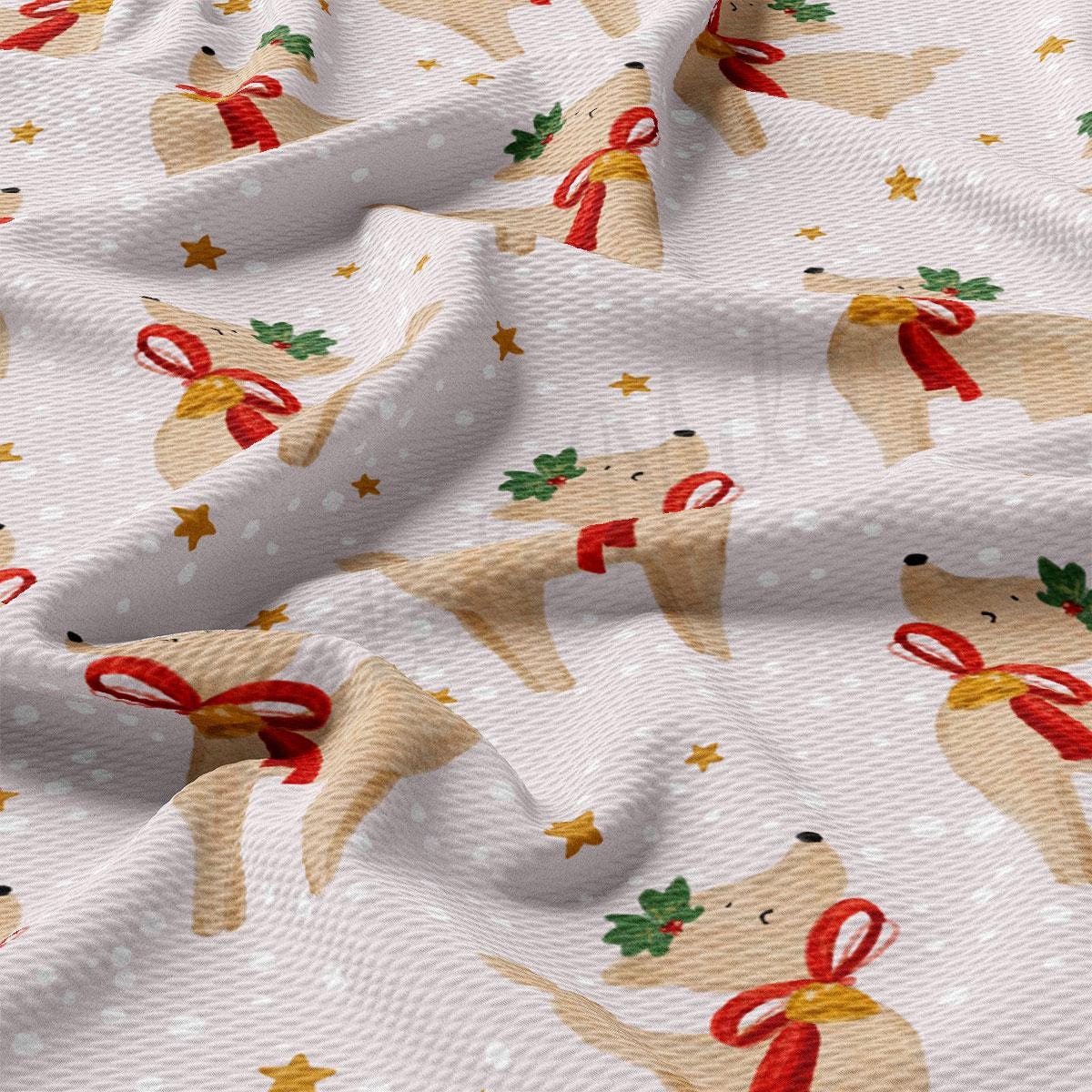a close-up view of a fabric with a repeating pattern of brown reindeer wearing red bows and green leaves, set against a white background with scattered gold stars.