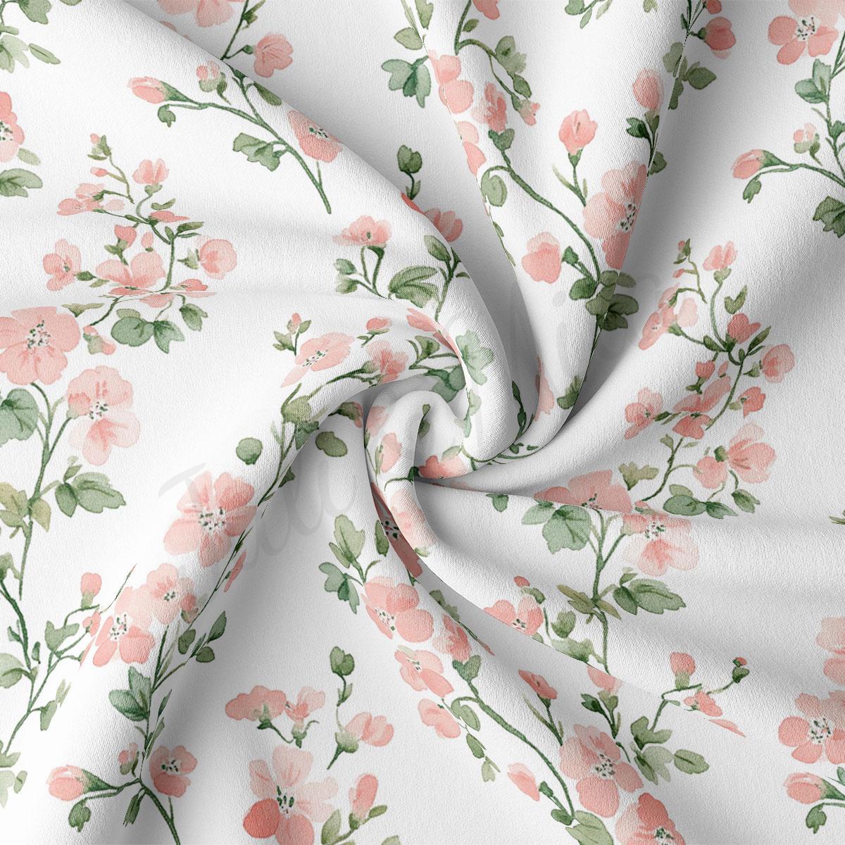 a close-up view of a fabric with a floral pattern of pink flowers and green leaves. The fabric appears to be white, and the pattern is intricate and detailed, with the flowers and leaves arranged in a repeating design across the fabric's surface.