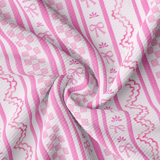 a close up of a pink and white striped fabric