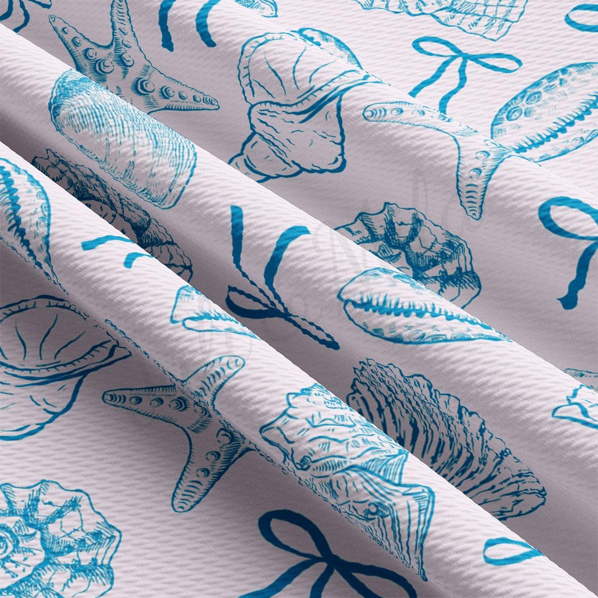 a close up of a blue and white pattern on fabric