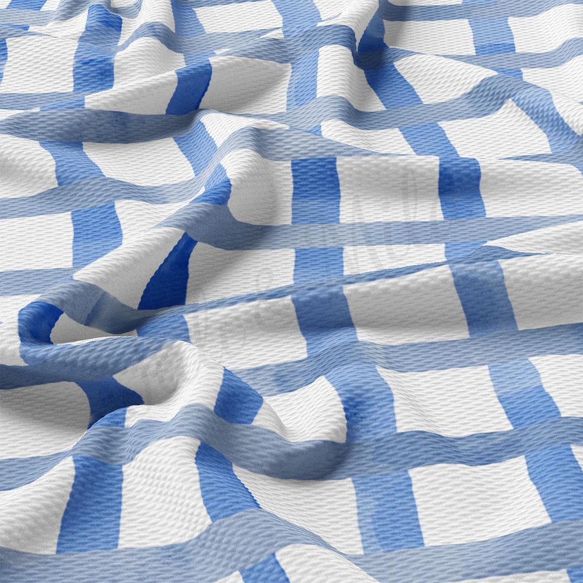 a blue and white checkered fabric with wavy lines
