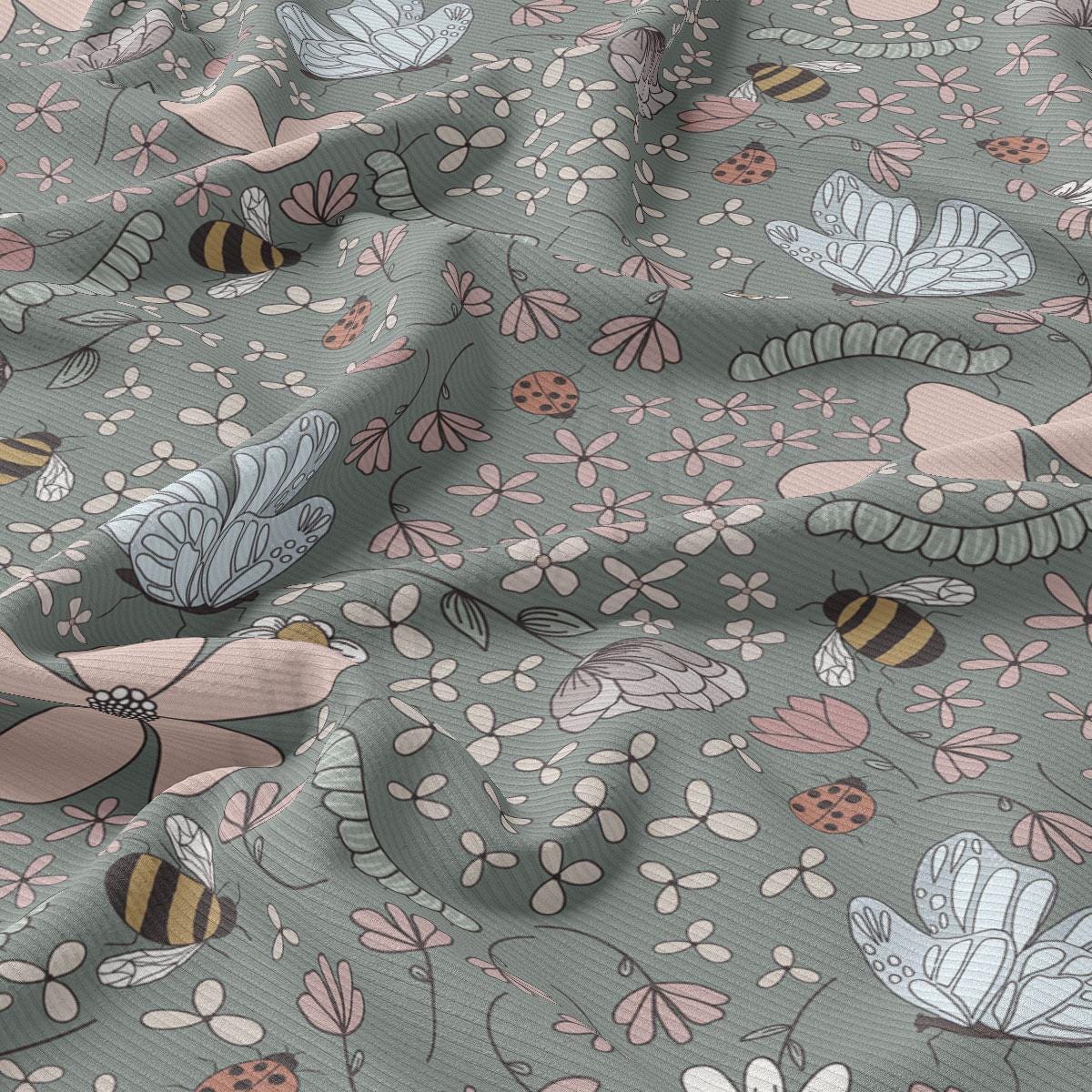 a pattern of flowers and bees on a gray background