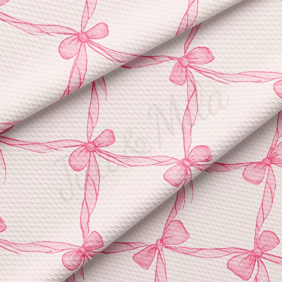 a repeating pattern of pink bows on a white background.