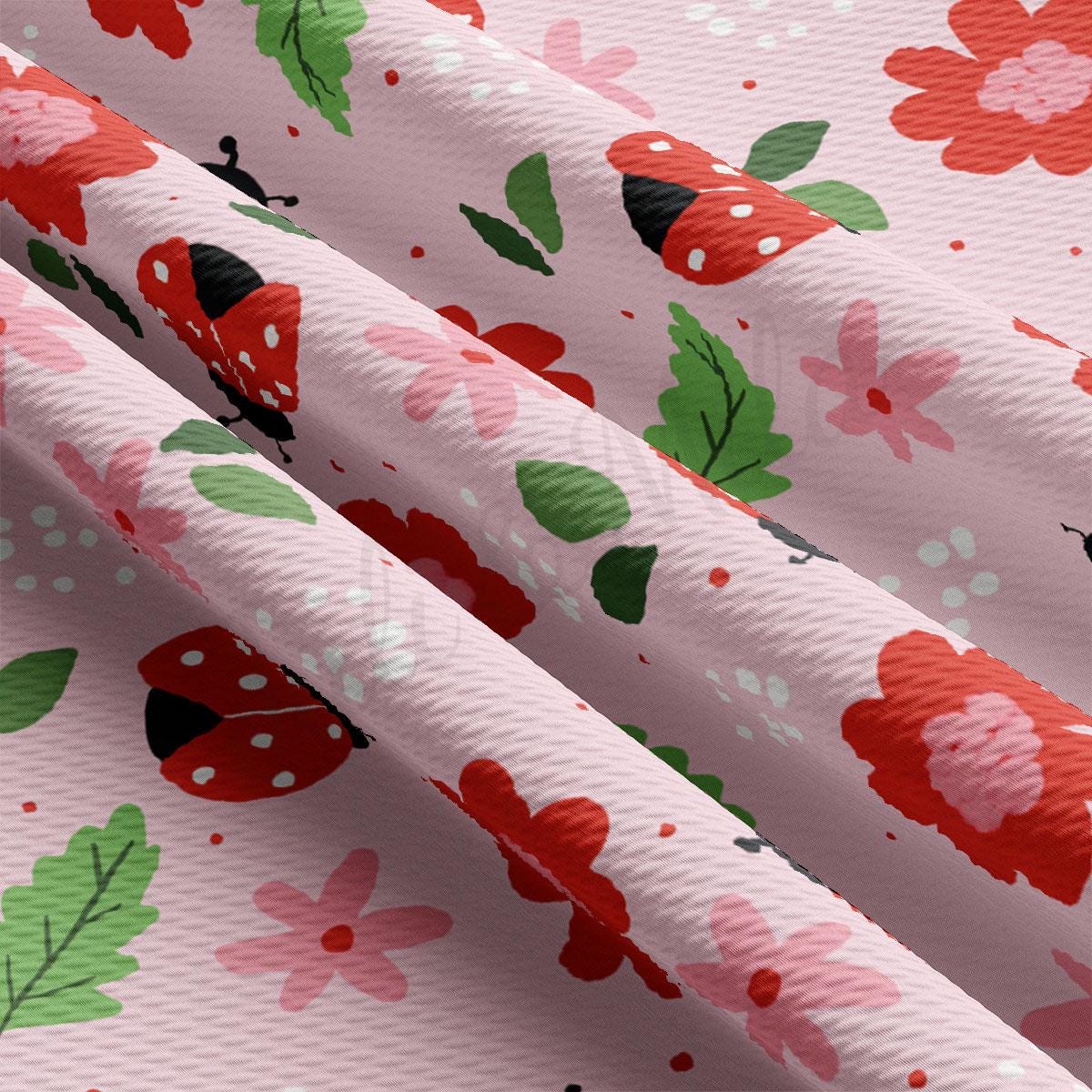 a pink background with red flowers and green leaves