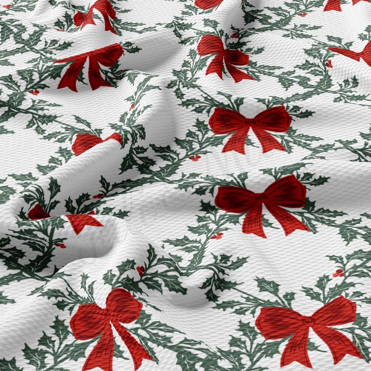 a close-up view of a fabric with a repeating pattern of red bows and holly leaves. The bows are arranged in a diagonal pattern, creating a sense of movement across the fabric. The holly leaves are depicted in a more intricate and detailed manner, adding a festive touch to the overall design. The fabric appears to be made of a soft, plush material, suitable for holiday-themed clothing or home decor items.