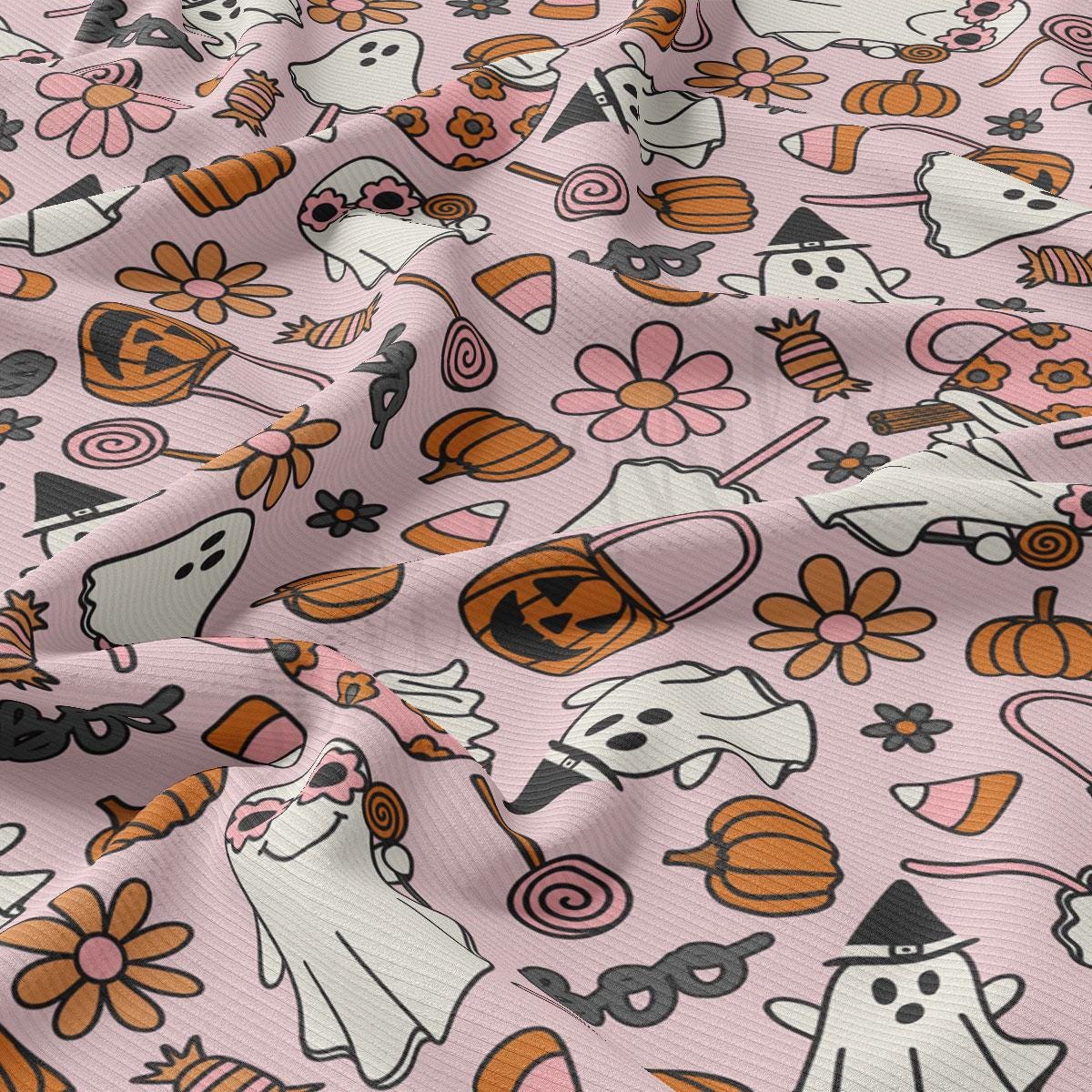 a pink background with a pattern of halloween characters