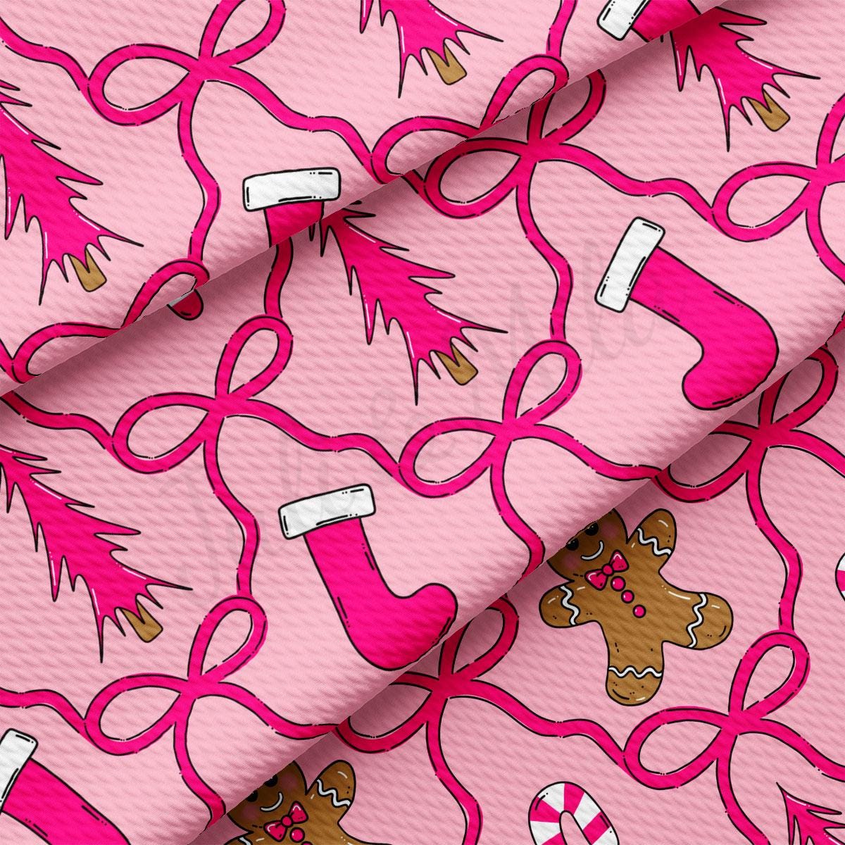 a repeating pattern of pink Christmas trees, pink Santa Claus hats, and pink gingerbread men on a pink background.