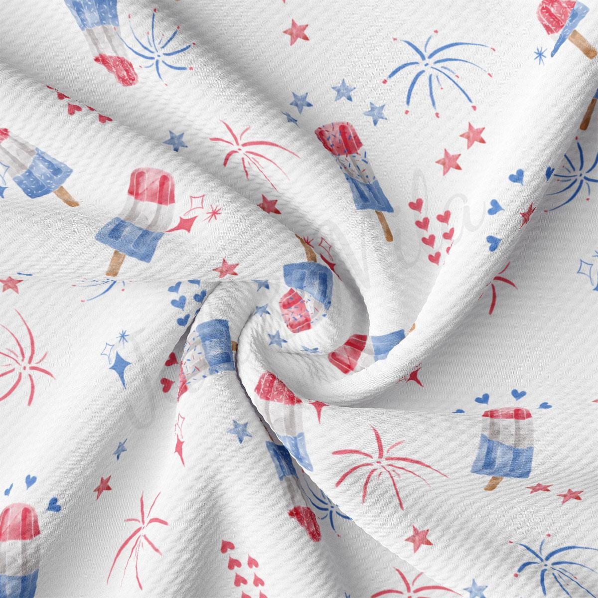 a white fabric with red, white and blue fireworks