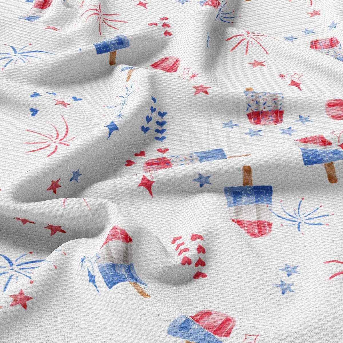 a white fabric with red, white, and blue fireworks
