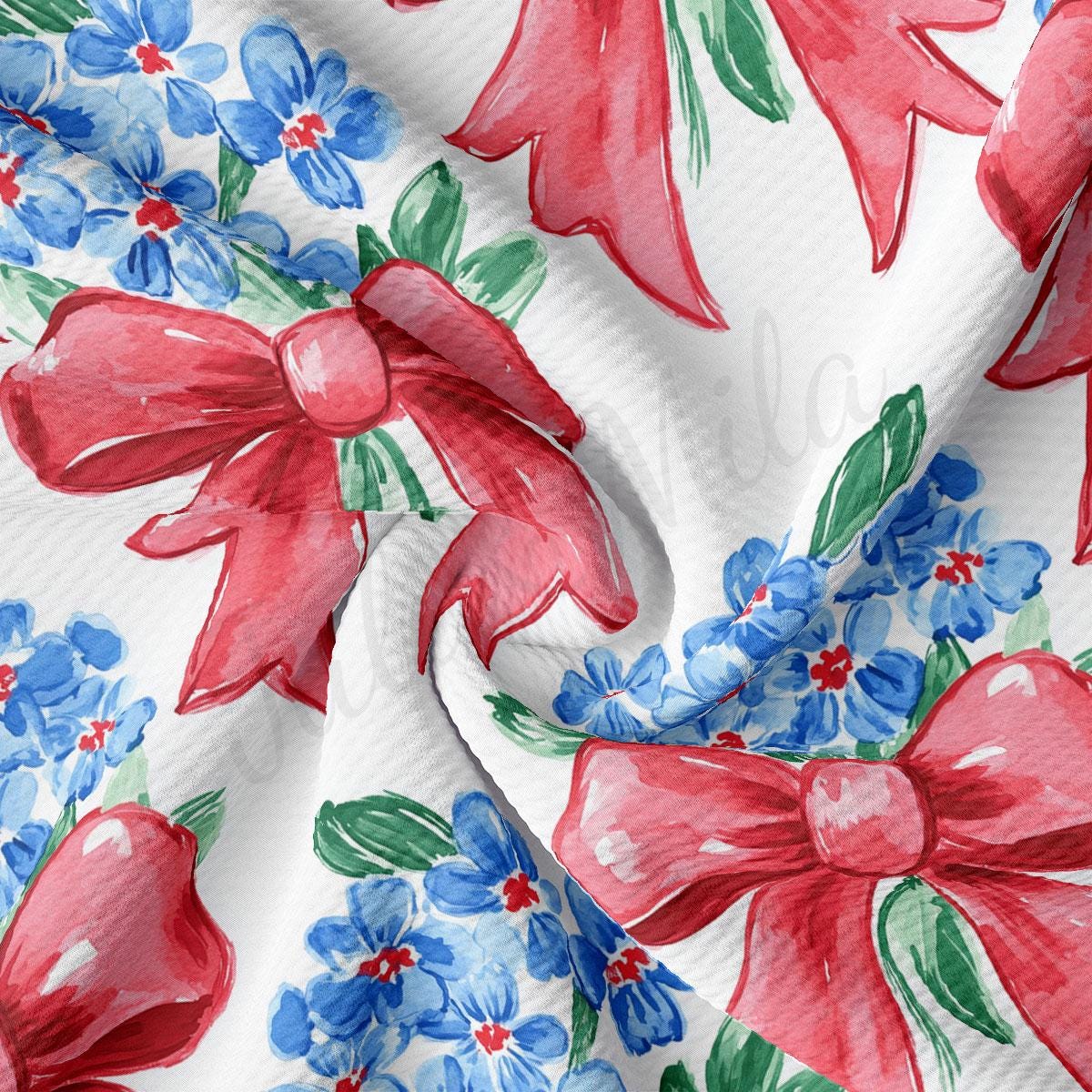 a red bow on a white background with blue and red flowers