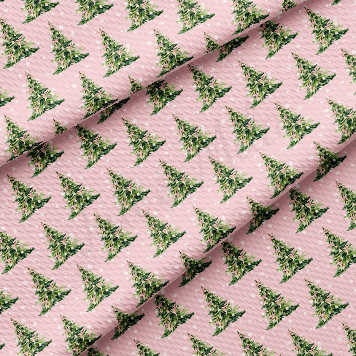 a repeating pattern of green Christmas trees on a pink background, creating a festive and holiday-themed design.