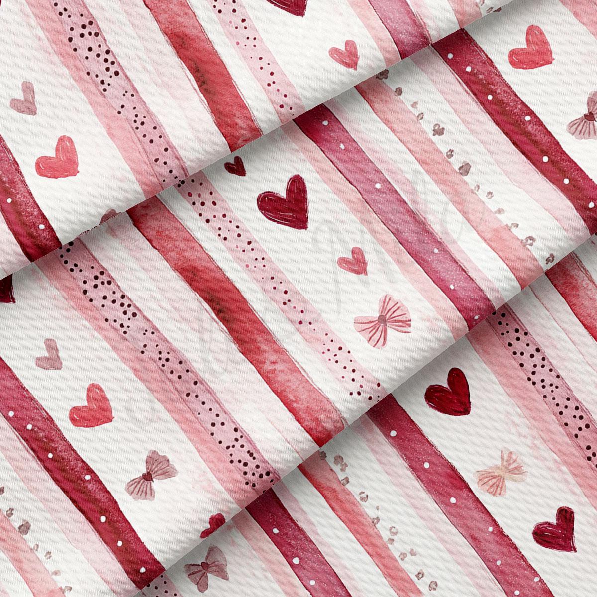 a close-up view of a fabric with a repeating pattern of pink and white stripes, hearts, and bows.