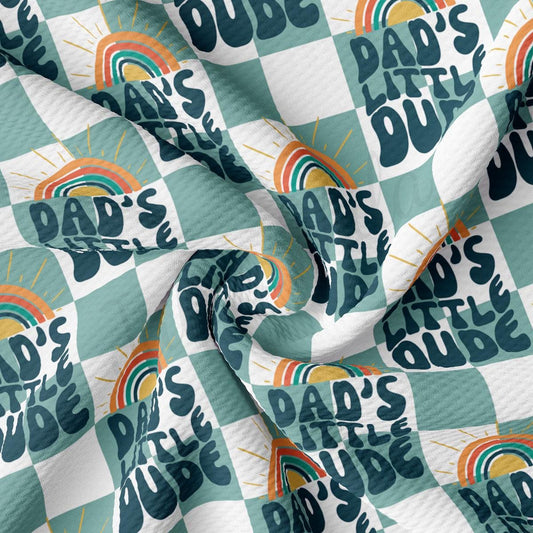 a blue and white checkered fabric with the words dad&#39;s little dude on