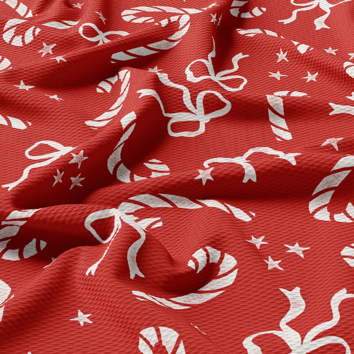 a red fabric with white designs on it