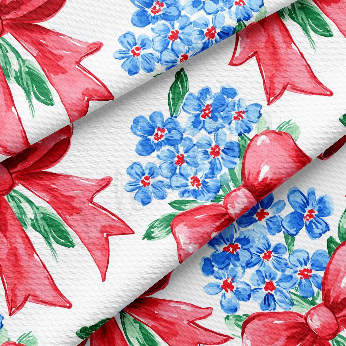 a red bow and blue flowers on a white background