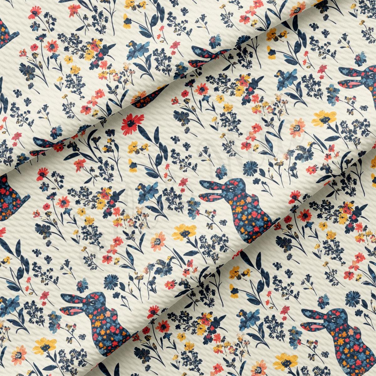 a fabric with a rabbit and flowers on it