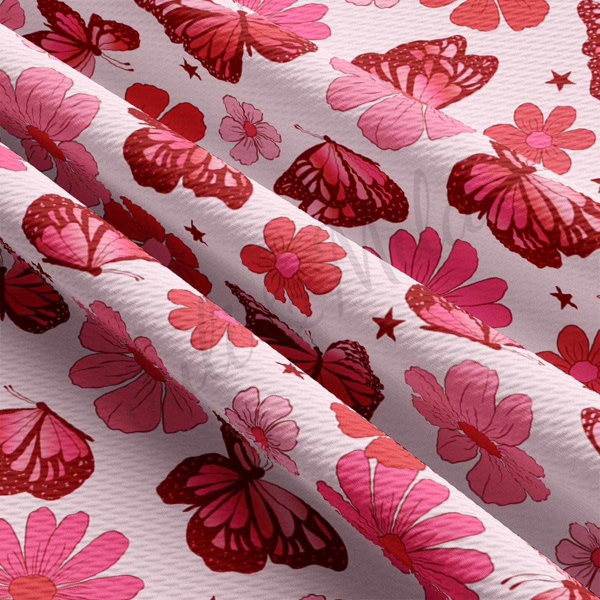a pink and red flower print on a white background