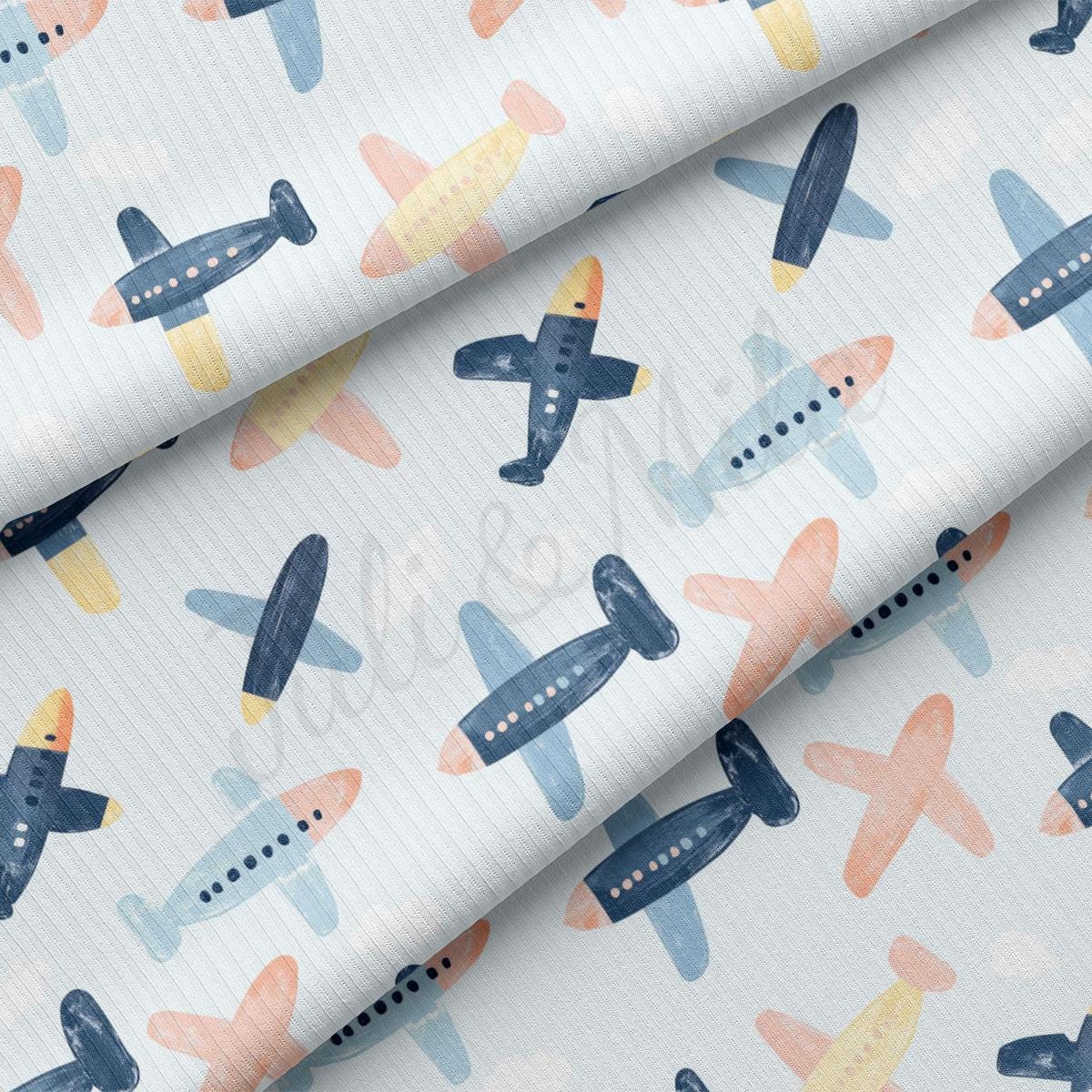 a pattern of small airplanes on a white background