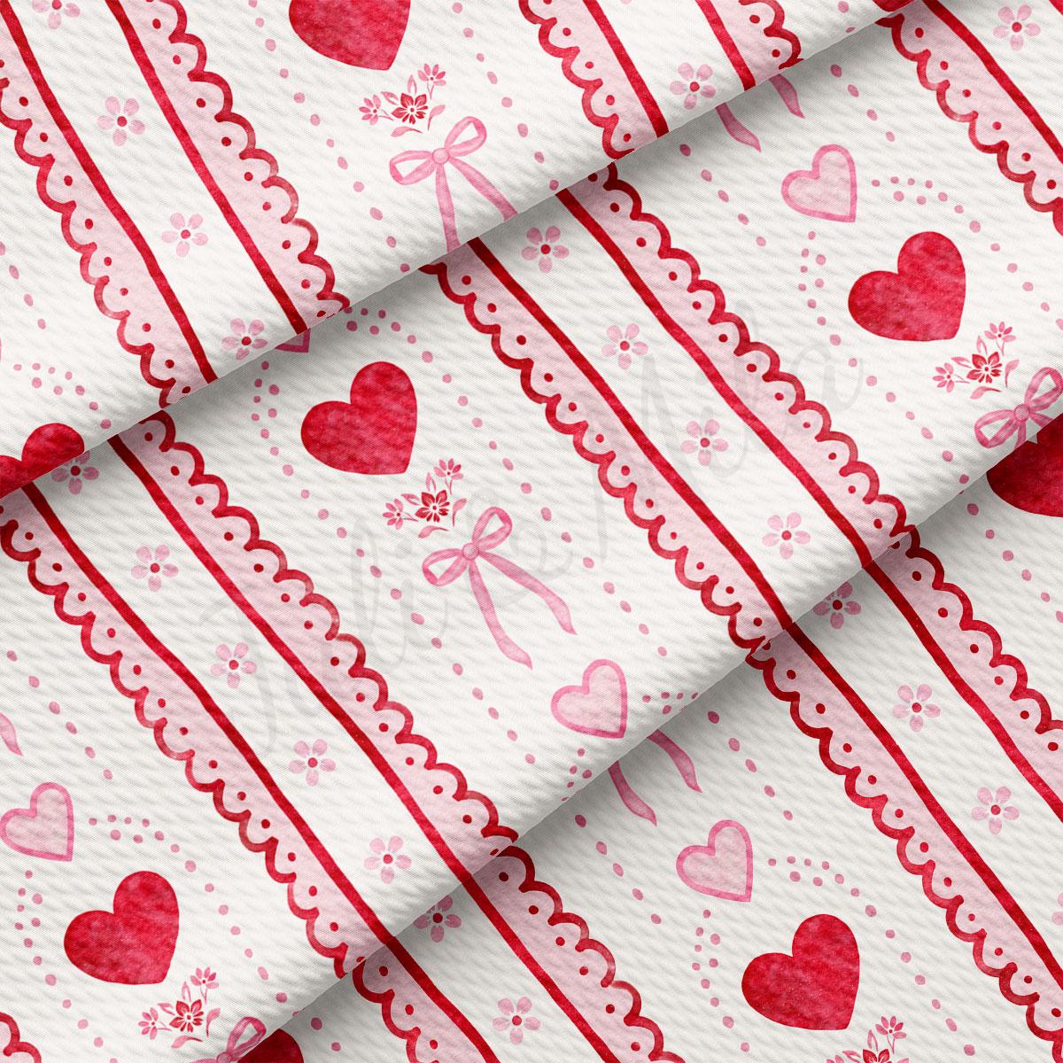 a close-up view of a fabric with a repeating pattern of red hearts and pink bows. The pattern is composed of diagonal lines and curves, creating a visually appealing and textured design.