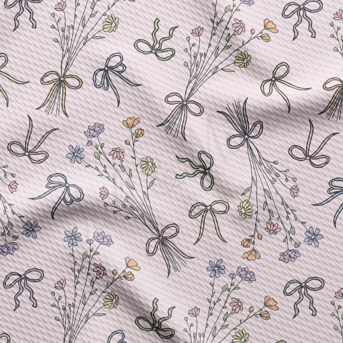 a pattern of bows and flowers on a white background